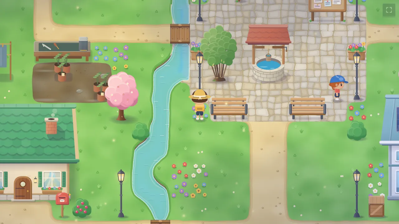 The town of Hazelbrook: a cobbled square with a well, a stream and cottages